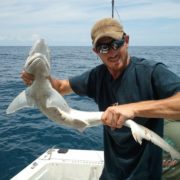Ian Martin, Certified KY Arborist, holding a fish he caught while deep sea fishing